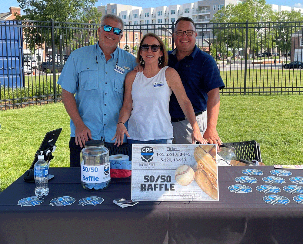 CPF board members Steve and Jennifer with Lt. Hubbard at the July 4th Cannon Ballers game; staffing the 50/50 Raffle tent
